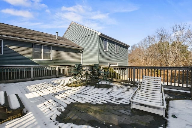 view of snow covered deck