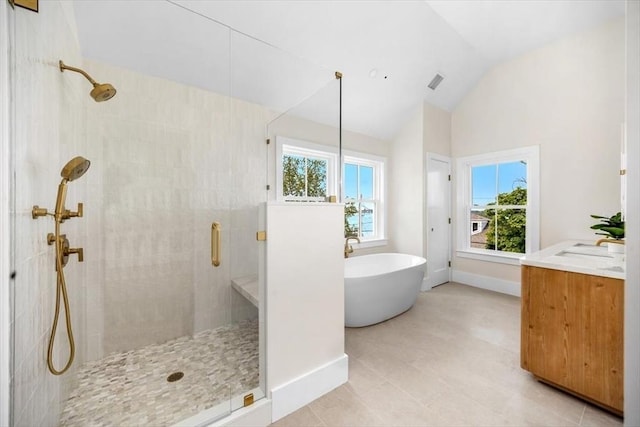 34 Otis Hill Rd, Hingham, MA 02043 - full bathroom featuring a stall shower, vaulted ceiling, a freestanding bath, baseboards, and vanity