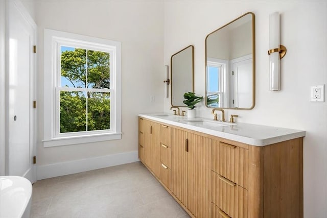 34 Otis Hill Rd, Hingham, MA 02043 - full bathroom with double vanity, baseboards, and tile patterned flooring