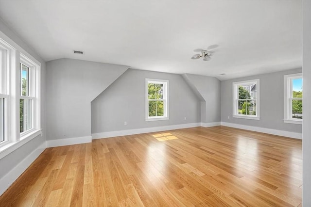 34 Otis Hill Rd, Hingham, MA 02043 - additional living space with light wood-style flooring, healthy amount of natural light, baseboards, and vaulted ceiling