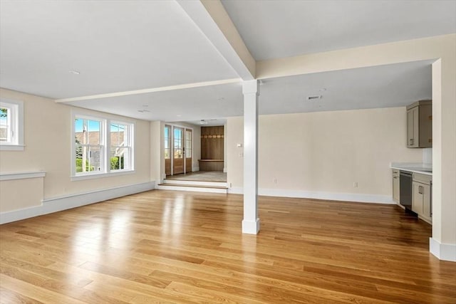34 Otis Hill Rd, Hingham, MA 02043 - unfurnished living room with healthy amount of natural light, light wood-style floors, and baseboards