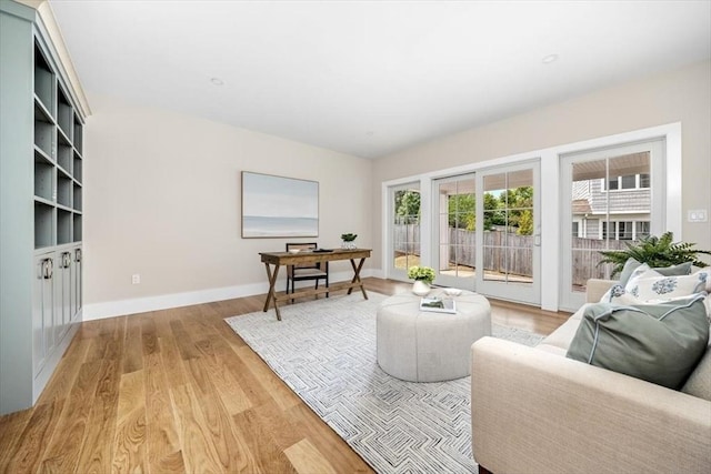 34 Otis Hill Rd, Hingham, MA 02043 - living room featuring light wood-type flooring and baseboards