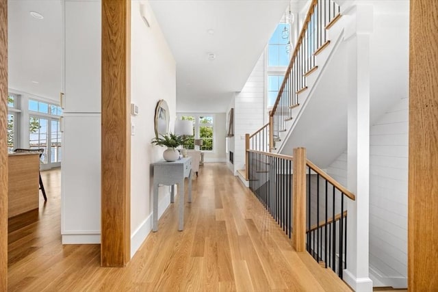 34 Otis Hill Rd, Hingham, MA 02043 - hallway featuring light wood-style flooring, stairs, and baseboards