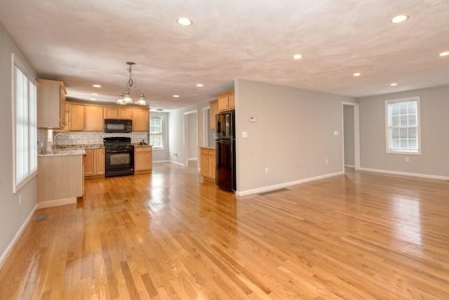 2 Dalton Ter, Holbrook, MA 02343 - unfurnished living room with recessed lighting, healthy amount of natural light, and light wood finished floors