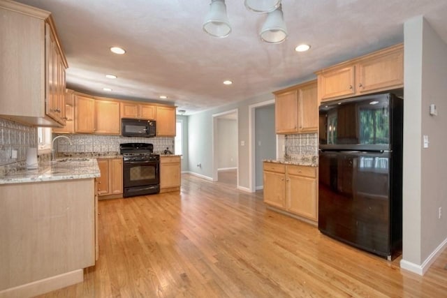2 Dalton Ter, Holbrook, MA 02343 - kitchen with black appliances, tasteful backsplash, light wood-type flooring, light stone countertops, and recessed lighting