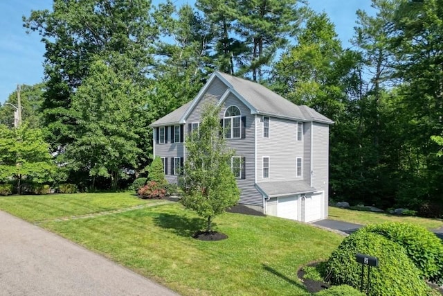 2 Dalton Ter, Holbrook, MA 02343 - view of front of house with a garage, driveway, and a front lawn
