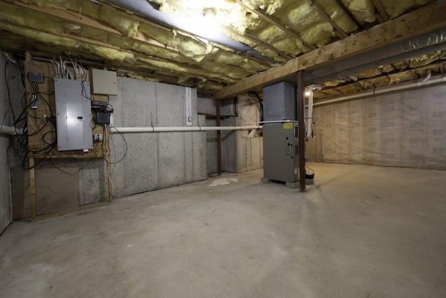 2 Dalton Ter, Holbrook, MA 02343 - unfinished below grade area with electric panel and heating unit