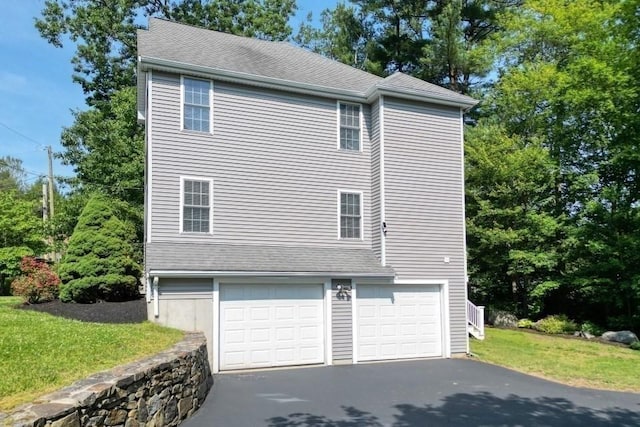 2 Dalton Ter, Holbrook, MA 02343 - view of side of property featuring driveway and an attached garage