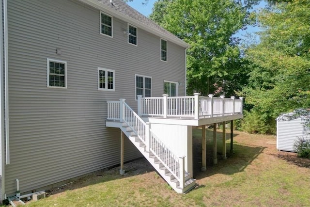 2 Dalton Ter, Holbrook, MA 02343 - rear view of property featuring a deck, a yard, a storage shed, and stairs
