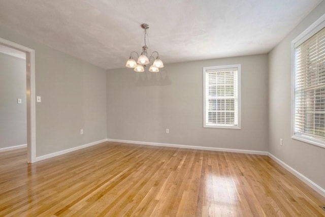 2 Dalton Ter, Holbrook, MA 02343 - unfurnished room featuring a chandelier and light wood-type flooring