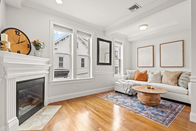 53 Woodward St Unit 2, Boston, MA 02127 - living room with light wood-type flooring, a fireplace with flush hearth, baseboards, crown molding, and recessed lighting