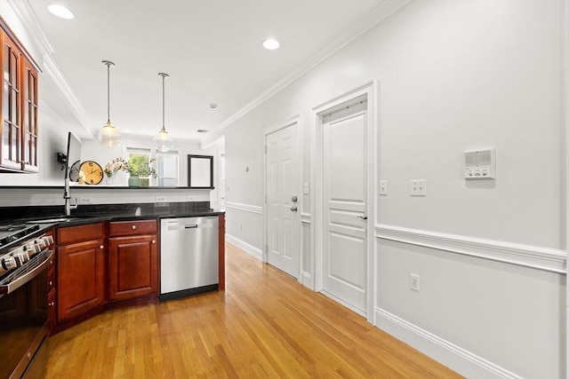 53 Woodward St Unit 2, Boston, MA 02127 - kitchen featuring appliances with stainless steel finishes, light wood-style flooring, dark countertops, pendant lighting, and glass insert cabinets