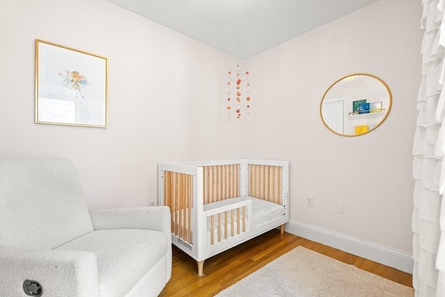 53 Woodward St Unit 2, Boston, MA 02127 - bedroom with wood finished floors and baseboards
