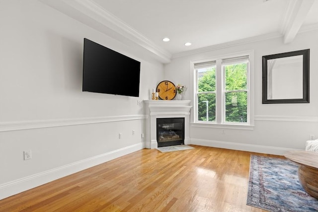 53 Woodward St Unit 2, Boston, MA 02127 - unfurnished living room featuring light wood-style flooring, a fireplace with flush hearth, crown molding, baseboards, and recessed lighting