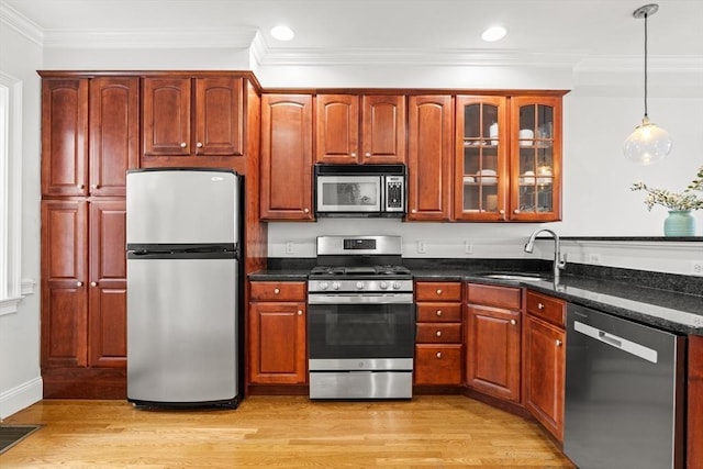 53 Woodward St Unit 2, Boston, MA 02127 - kitchen featuring stainless steel appliances, a sink, light wood-type flooring, recessed lighting, and glass insert cabinets