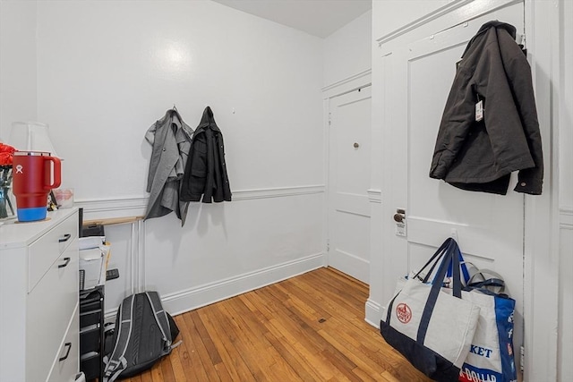 interior space with light wood finished floors and baseboards