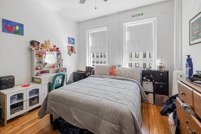 bedroom featuring light wood-style flooring and a ceiling fan