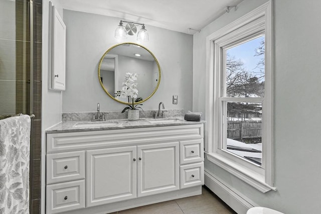 full bathroom featuring a sink and double vanity