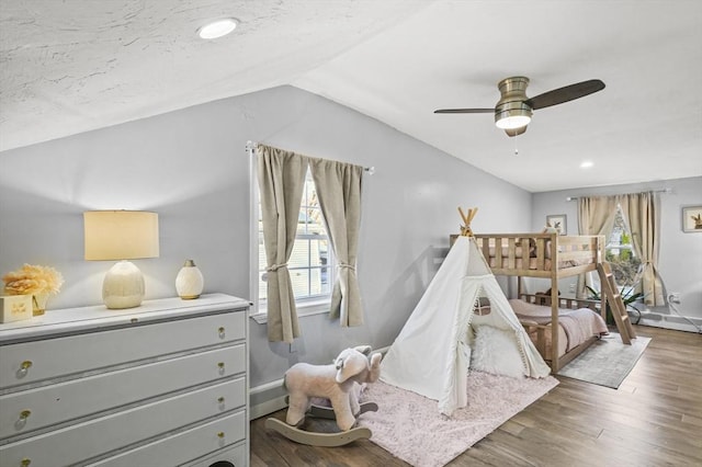 playroom with lofted ceiling, ceiling fan, and wood finished floors