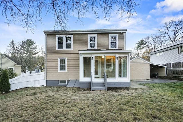 back of property with a sunroom, fence, a patio, and a yard