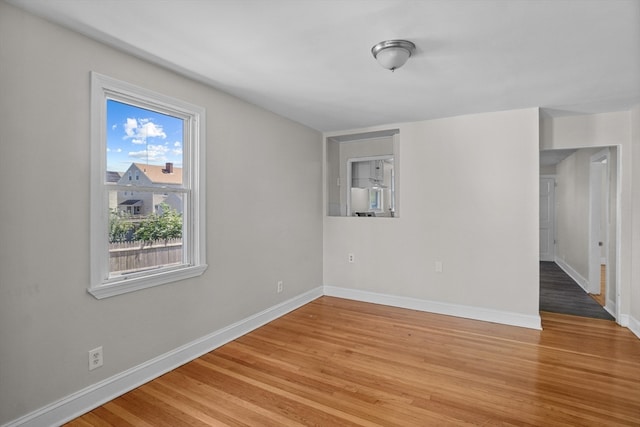 unfurnished room featuring hardwood / wood-style floors