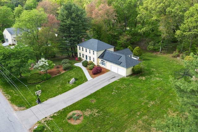 view of subject property featuring a heavily wooded area