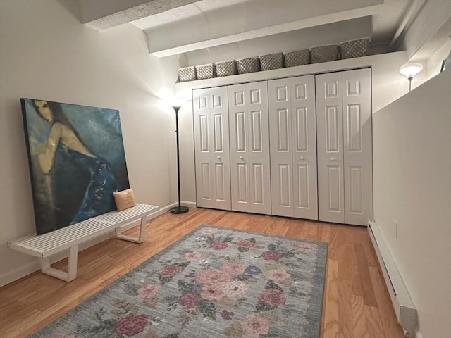 interior space featuring hardwood / wood-style floors and baseboard heating