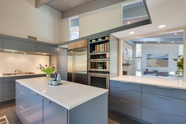 kitchen featuring visible vents, gray cabinets, appliances with stainless steel finishes, and modern cabinets