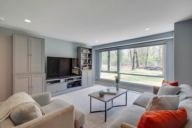 carpeted living area featuring recessed lighting