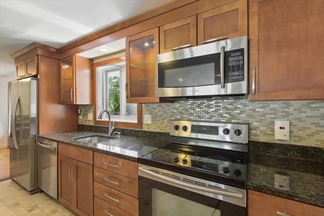 15 Temi Rd, Beverly, MA 01915 - kitchen with stainless steel appliances, a sink, and brown cabinetry