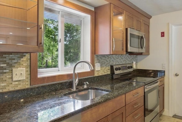 15 Temi Rd, Beverly, MA 01915 - kitchen with appliances with stainless steel finishes, a sink, brown cabinetry, and plenty of natural light
