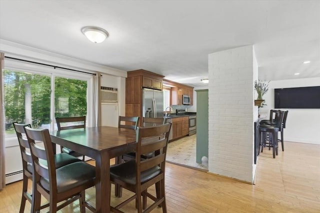 15 Temi Rd, Beverly, MA 01915 - dining area featuring light wood-style flooring, baseboard heating, a wall mounted air conditioner, recessed lighting, and ornate columns