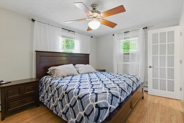 15 Temi Rd, Beverly, MA 01915 - bedroom with light wood-type flooring, baseboard heating, and ceiling fan