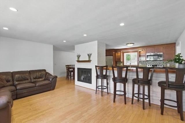 15 Temi Rd, Beverly, MA 01915 - living room featuring light wood finished floors, recessed lighting, and baseboards