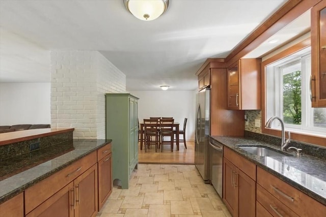 15 Temi Rd, Beverly, MA 01915 - kitchen with appliances with stainless steel finishes, a sink, and brown cabinetry