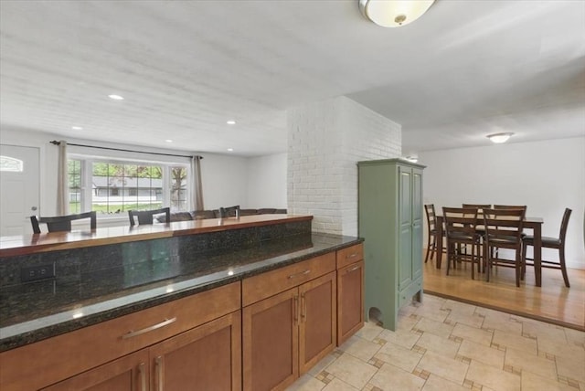 15 Temi Rd, Beverly, MA 01915 - kitchen with brown cabinets and dark stone countertops