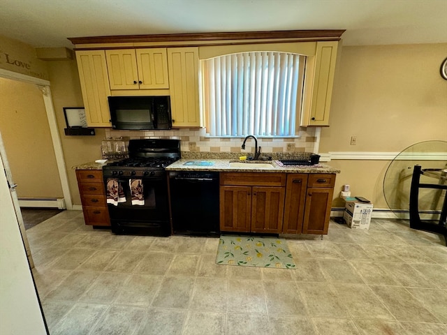 kitchen with sink, backsplash, black appliances, a baseboard radiator, and light stone countertops