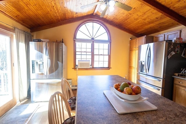 kitchen featuring vaulted ceiling with beams, wood ceiling, ceiling fan, and stainless steel refrigerator with ice dispenser