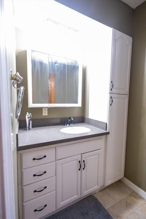 bathroom with vanity and tile patterned floors