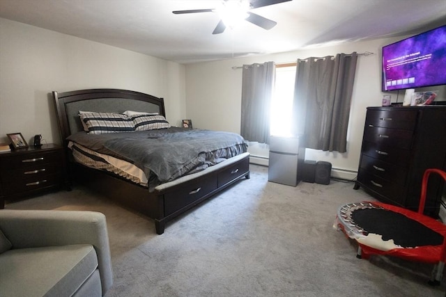 carpeted bedroom with a baseboard radiator and ceiling fan