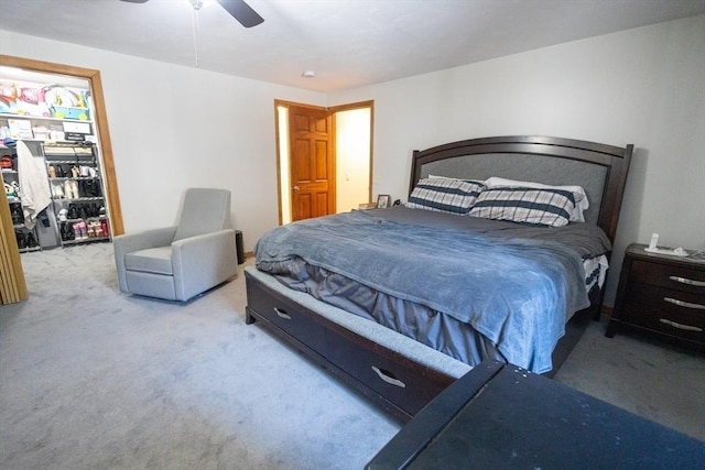 bedroom with light carpet and ceiling fan