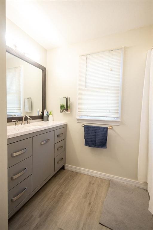 bathroom featuring vanity and hardwood / wood-style floors