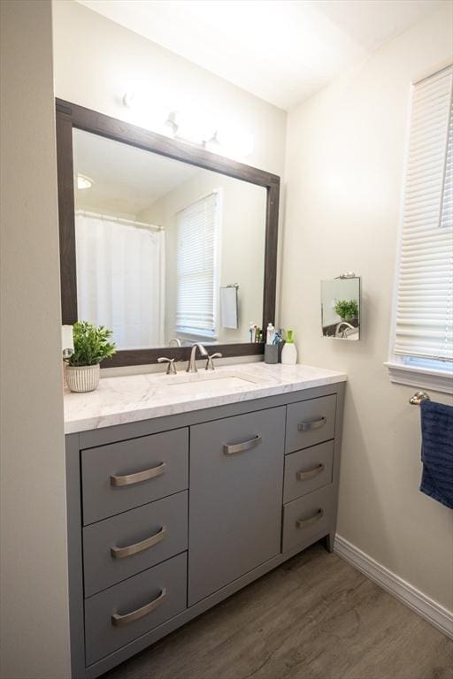 bathroom featuring vanity and hardwood / wood-style floors