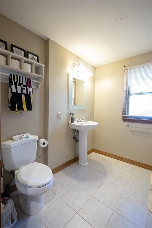 bathroom with tile patterned floors and toilet