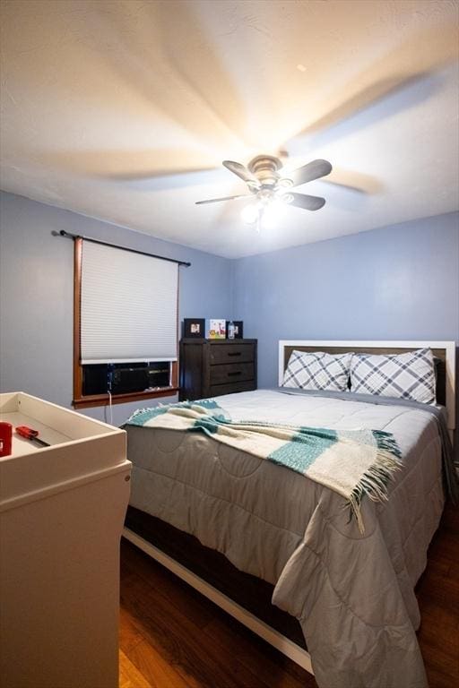 bedroom with wood-type flooring and ceiling fan