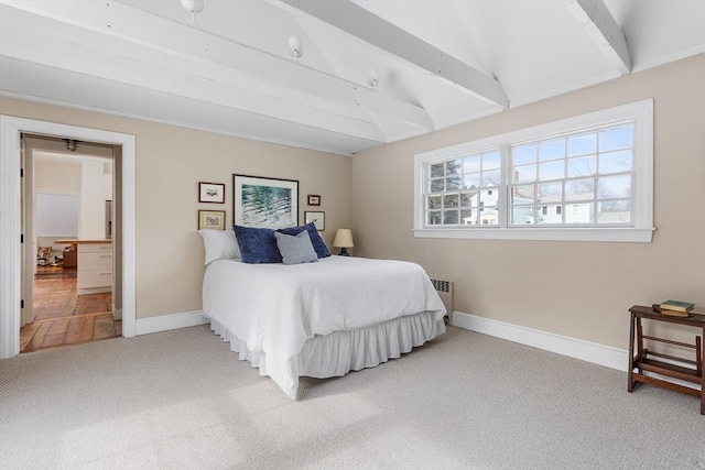 bedroom featuring light carpet, radiator heating unit, beam ceiling, and baseboards