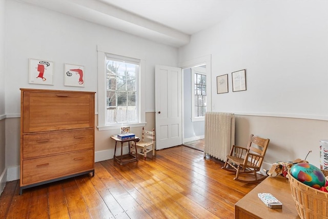 sitting room featuring wood-type flooring and baseboards