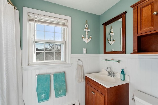 bathroom featuring toilet and vanity