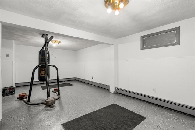 workout room featuring a baseboard radiator and a textured ceiling