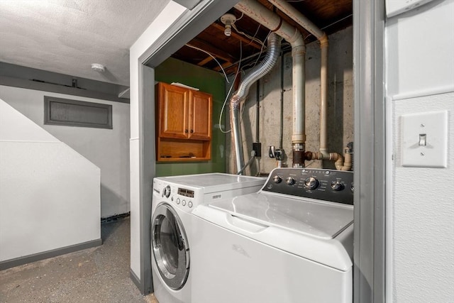 laundry area with cabinets and washing machine and dryer